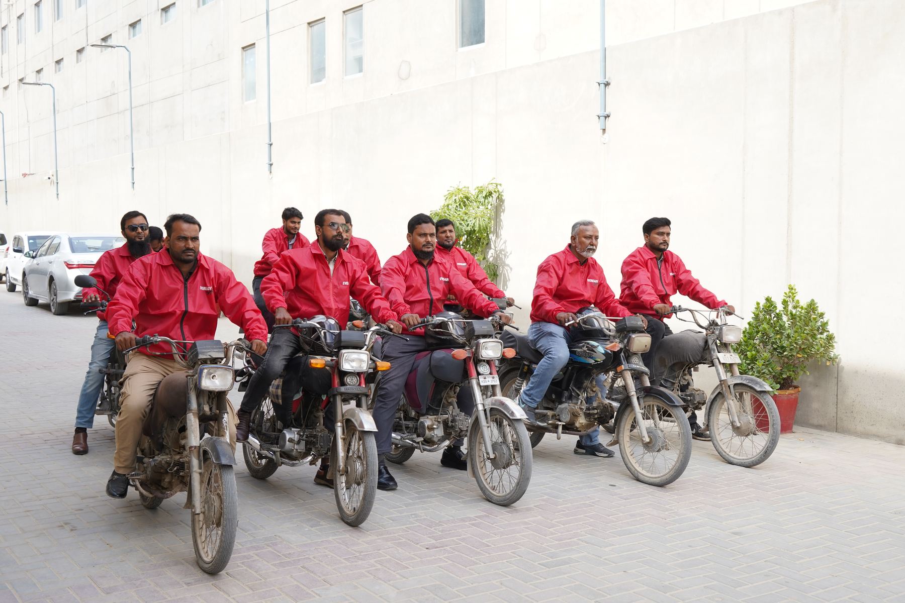 Tarseel sales team on motorbikes, ready for the market