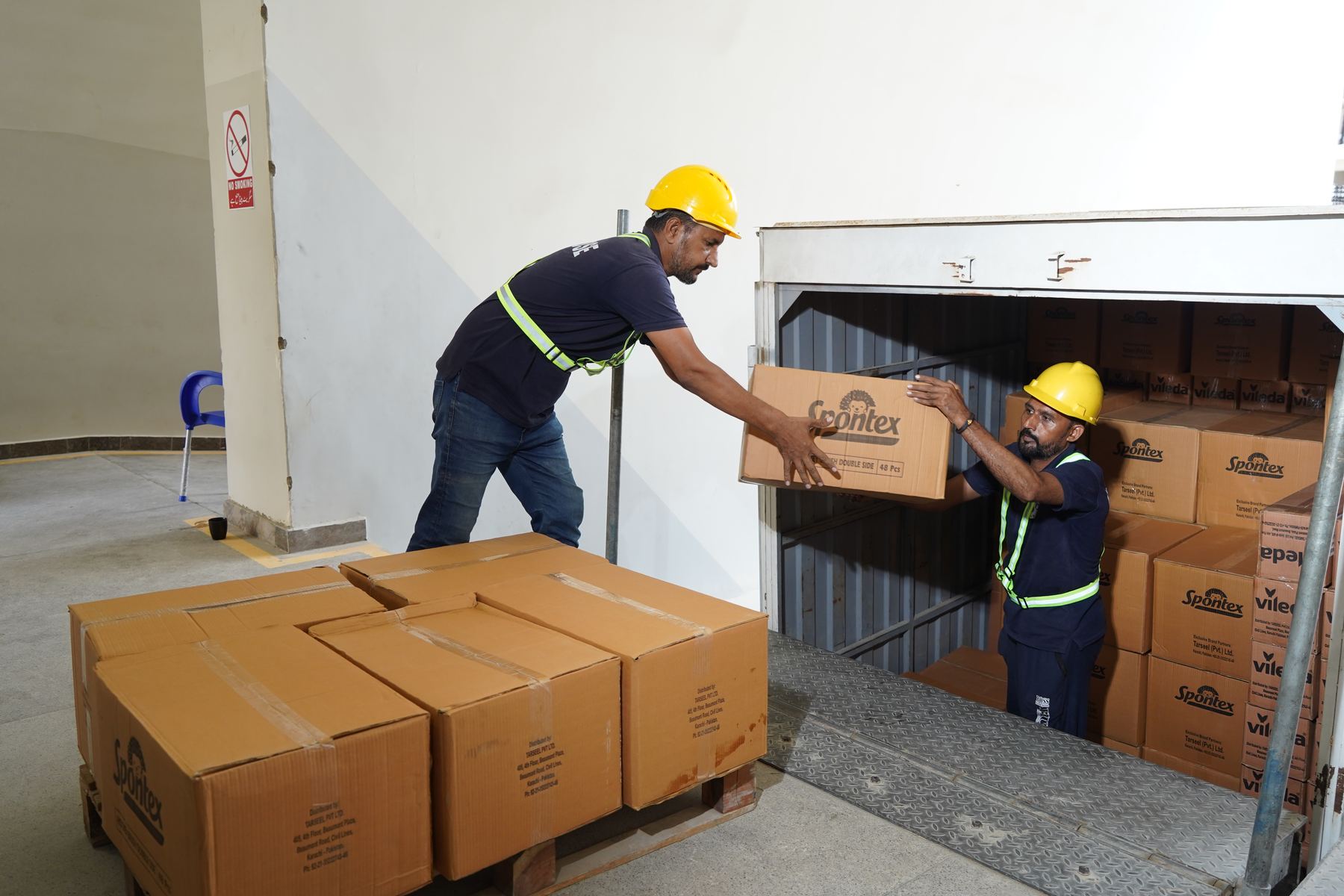 Warehouse team receiving imported stock